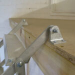 Dolle-Alufix-Vertical-Concertina-Loft-Ladder-open-close-up-view-brackets